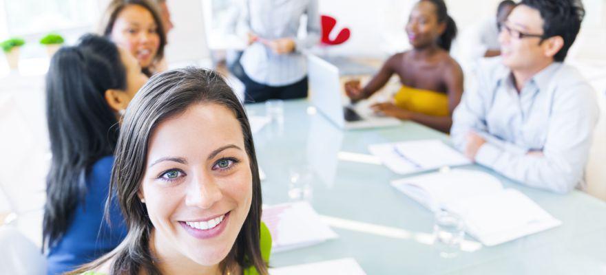 Business woman in conference with associates