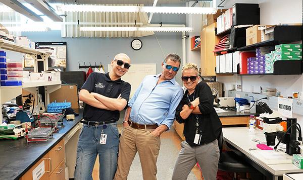 Drs. Kantorow and Brennan with Research Team posing with sunglasses